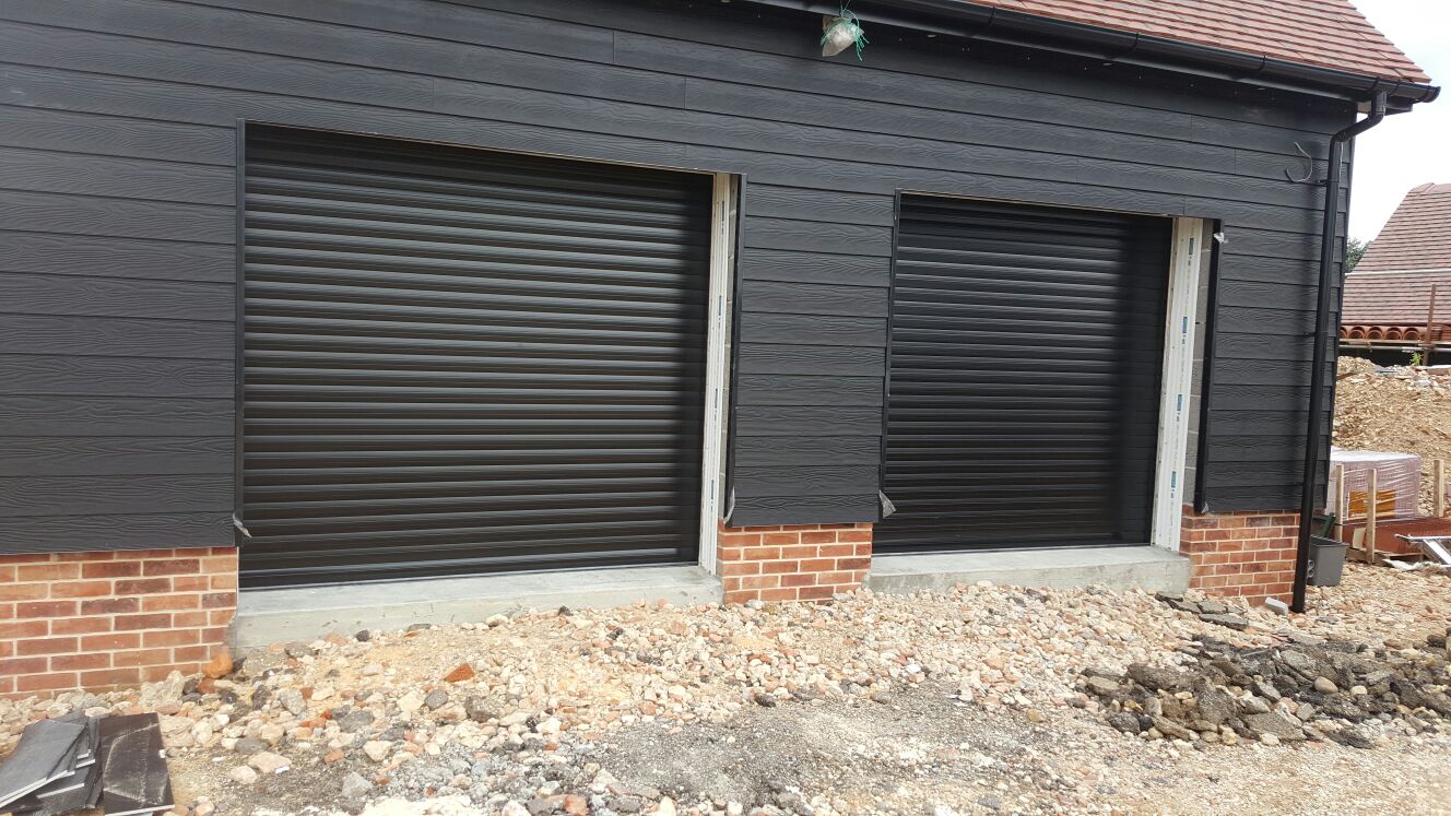 Double black roller garage doors by Rollerdor Ltd